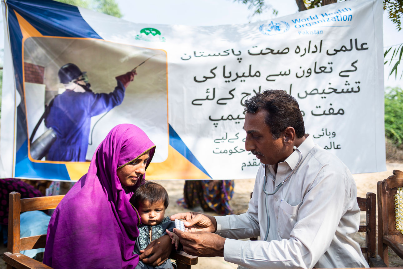 Mother and child receiving malaria treatment