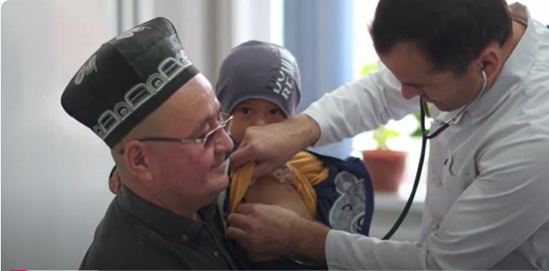 A doctor examines a child