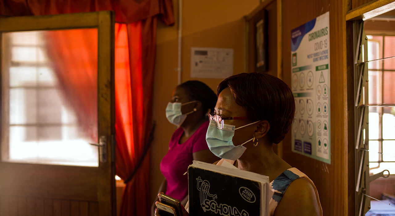 Dr Lion and WHO epidemiologist Idah Rikhotso visit in a dormitory at a school in Bloemfontein, South Africa.