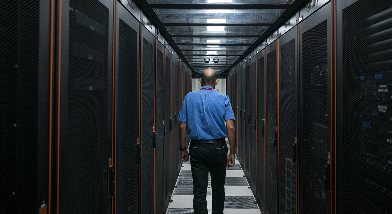 Mark Captur, manager and ICT Technical Fellow in the Infrastructure Services Department at the Malta Information Technology Agency, walks through the agency’s server room in Santa Venera in October 2021.