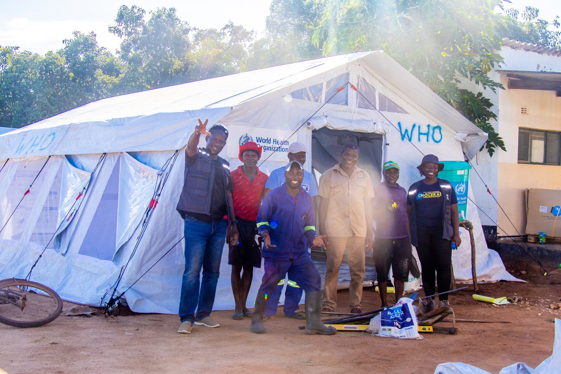 Personnel posing in front of Cholera Treatment Centre