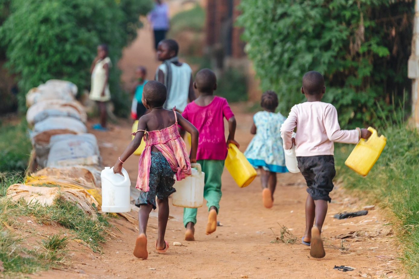 unsafe_drinking_water_sanitation_and_waste_management children walking to collect water