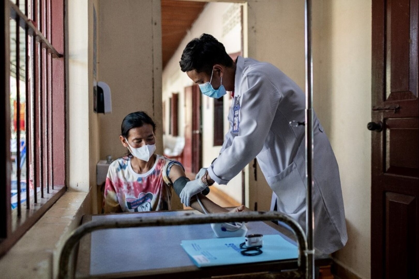Doctor checks blood pressure for patient