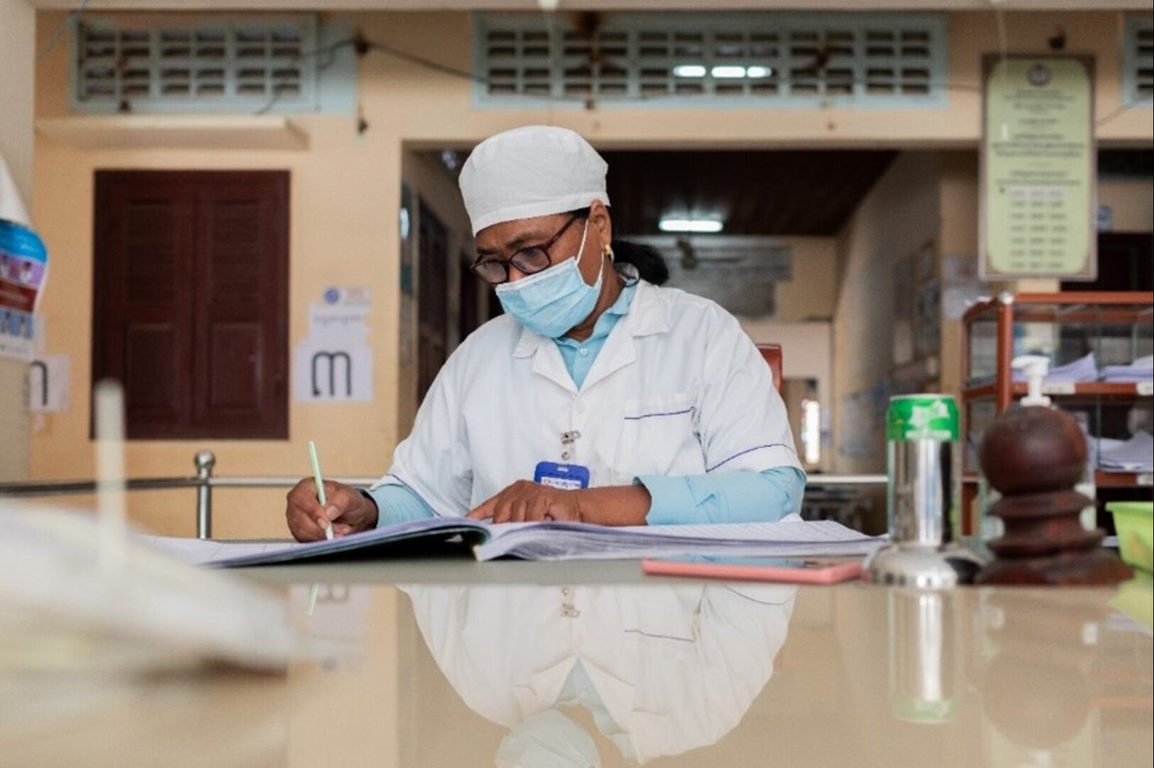 Health official writes down patient information