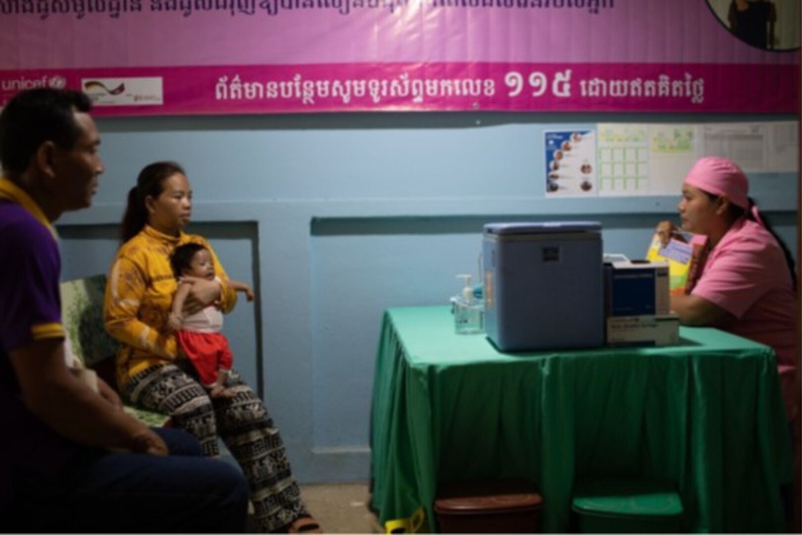 Nurse consults with local patients about symptoms concerning their baby son