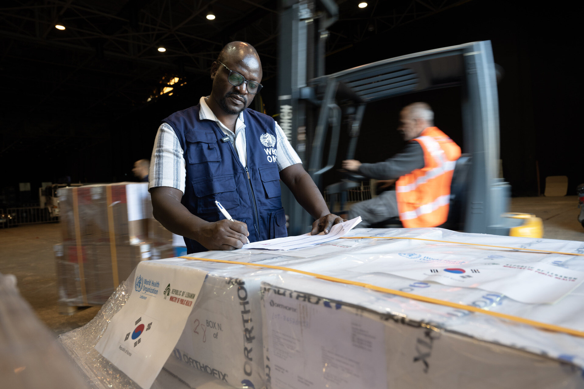 WHO Logistician Paul Otwani tracking delivery of WHO emergency medical supplies to Beirut warehouse