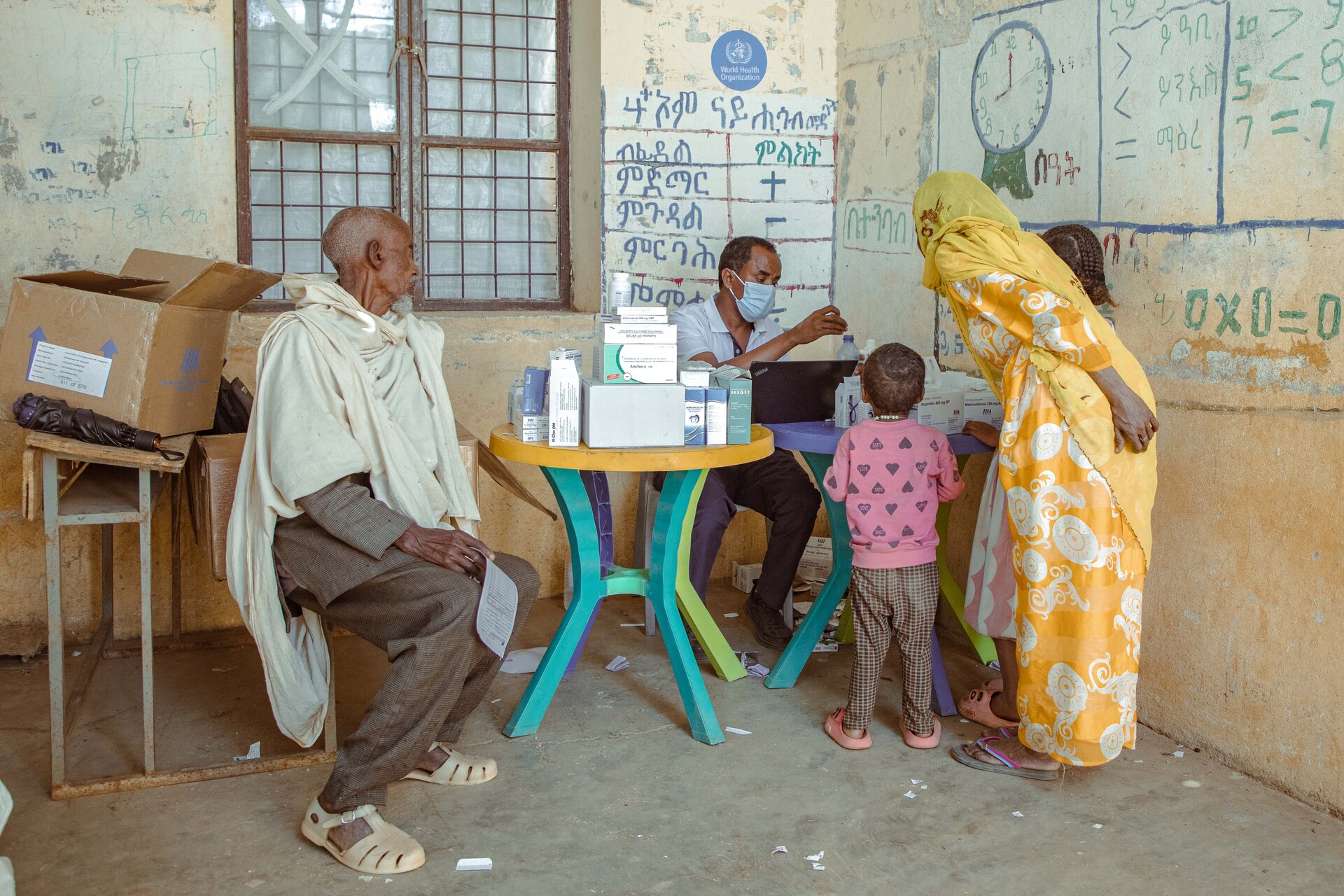 Health worker with beneficiaries