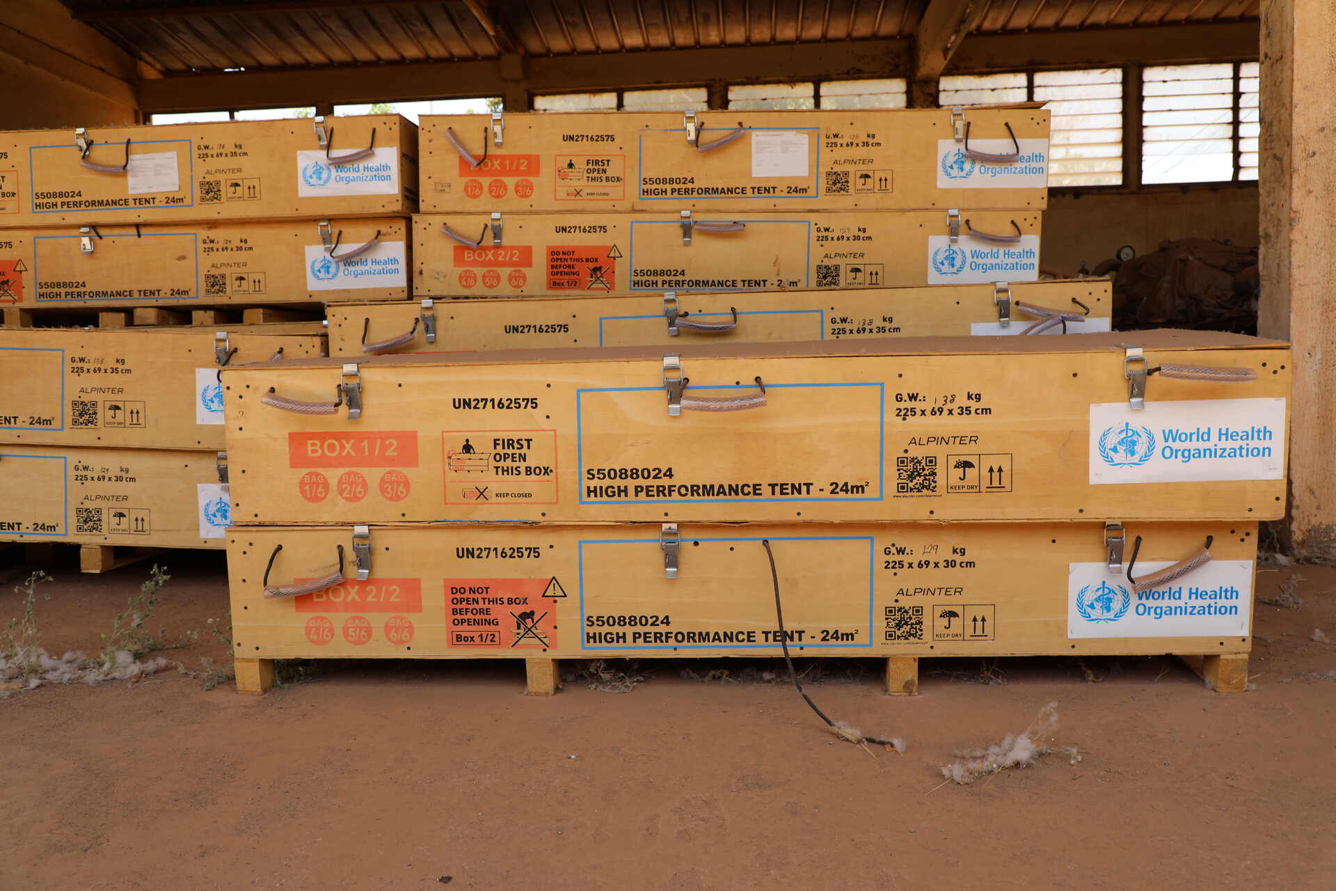 Boxes of WHO high-performance tents for medical posts at a warehouse