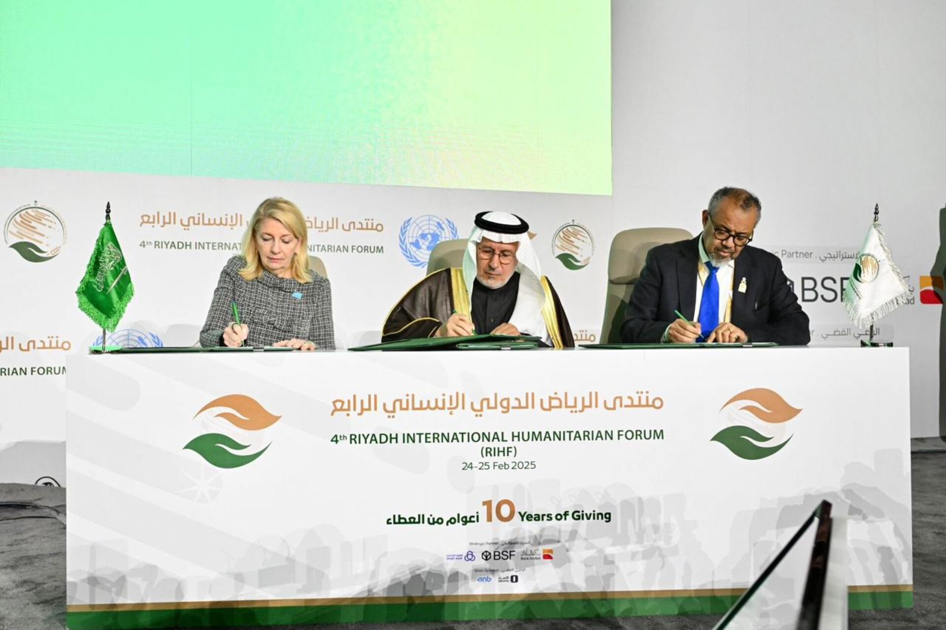UNICEF Executive Director, KSRelief Supervisor-General, and WHO Director-General signing agreement