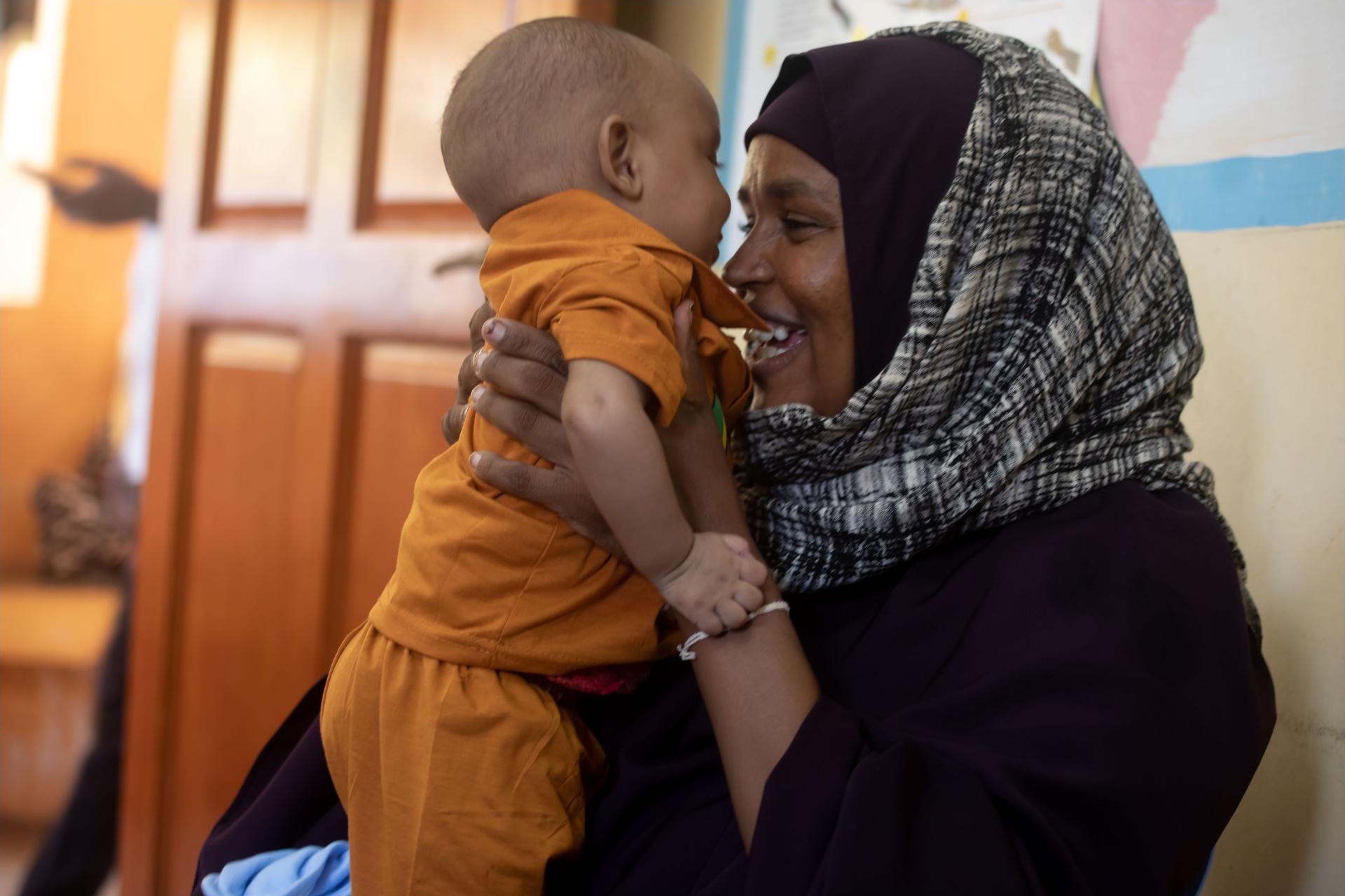 A mother and her child at a Public Health Centre of one of the drought-affected districts in Kismayo, Somalia