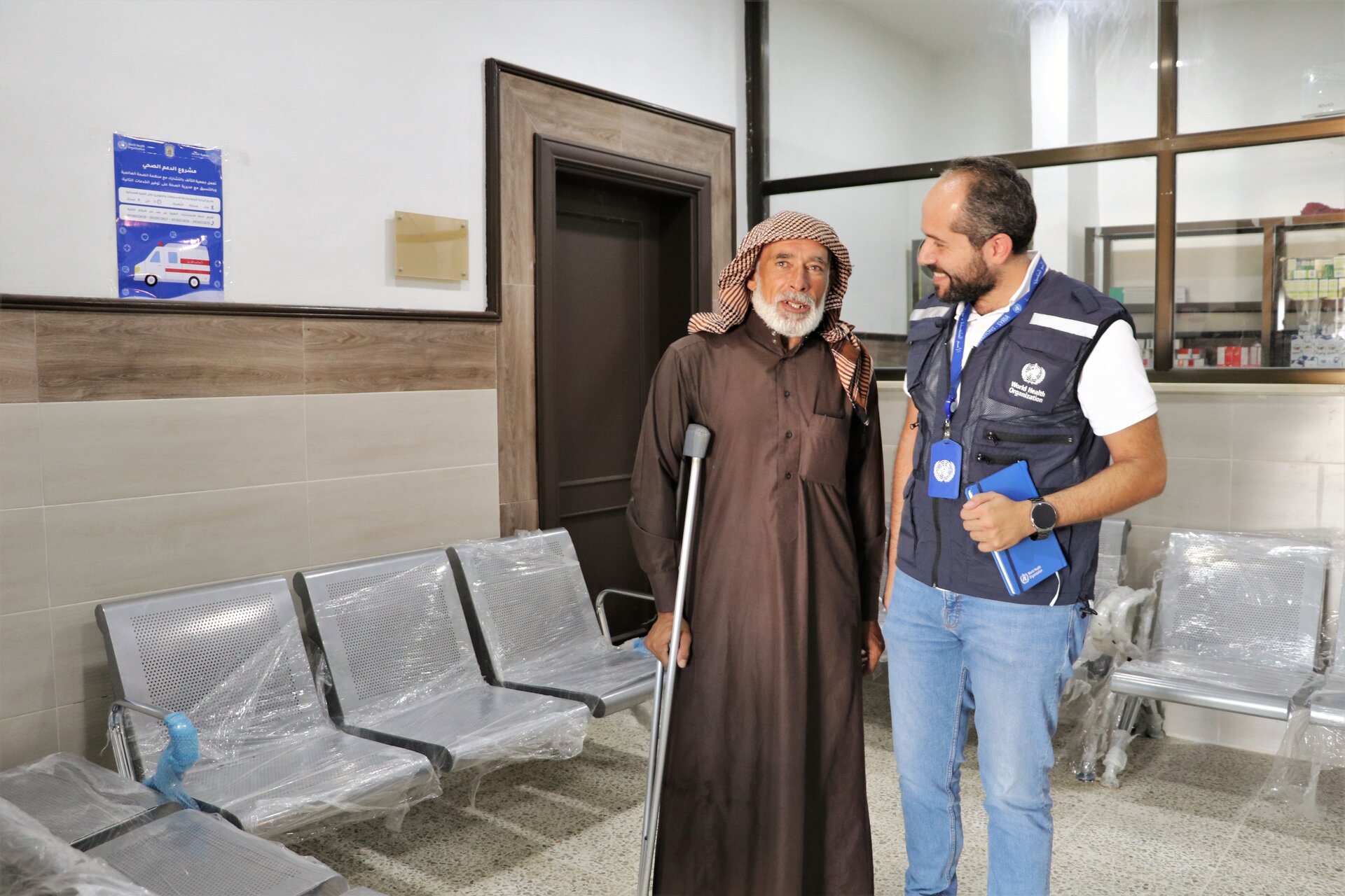 WHO staff with beneficiary at health centre in rural Aleppo