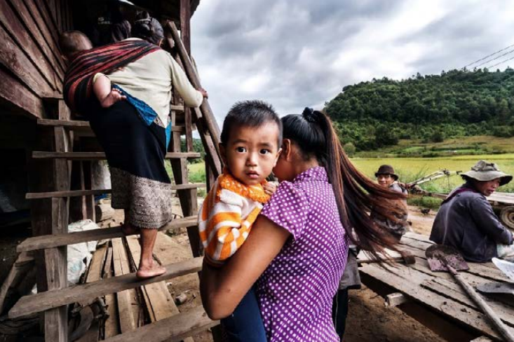 A mother with her child from a remote village in Xiangkhouang Province