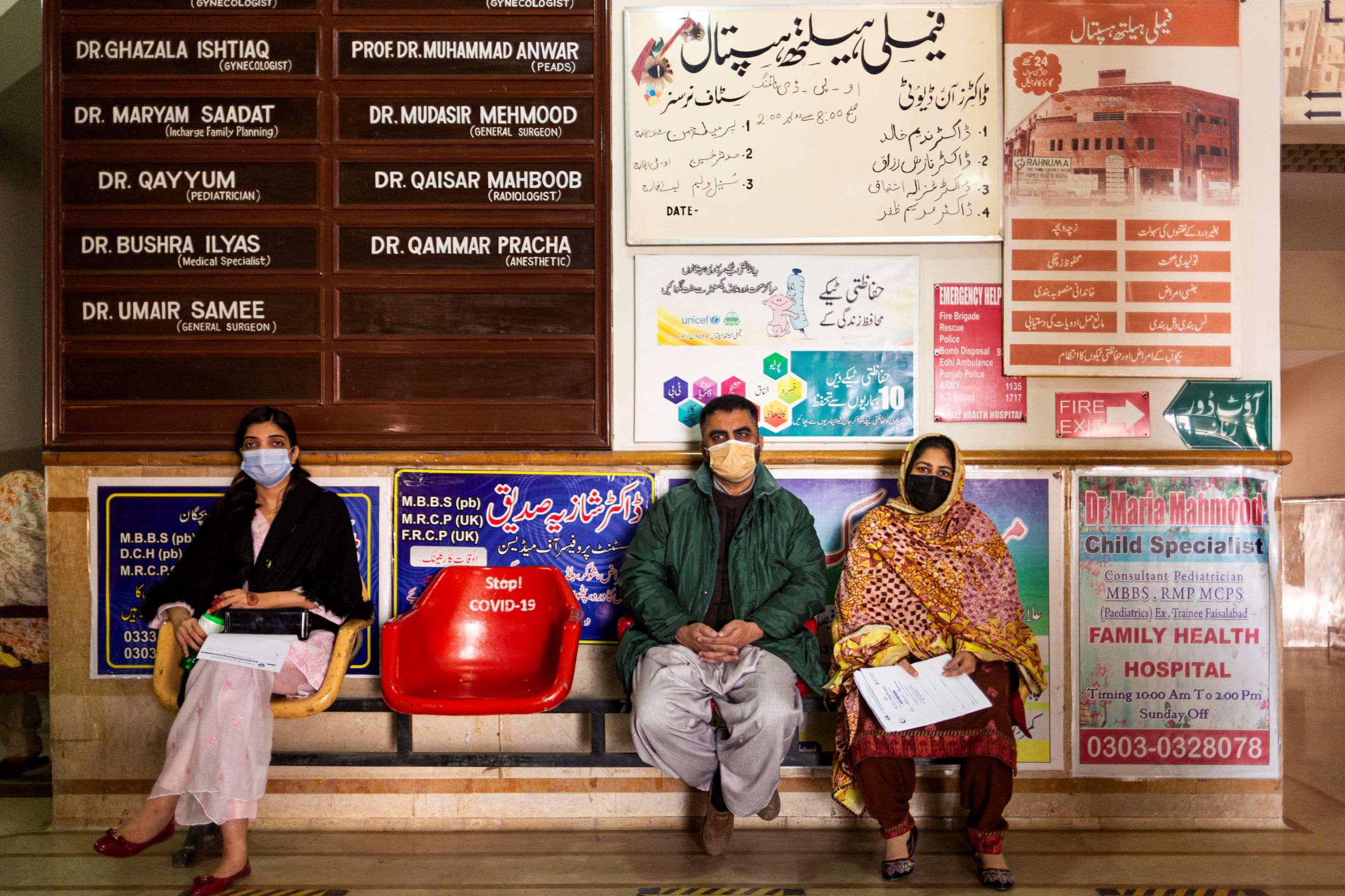 Shahid Waheed (left), Shagufta Shahid (centre) and Rabia Farhan (right) sit in the waiting area at Family Health Hospital in Lahore, Pakistan, on 1 February 2021.