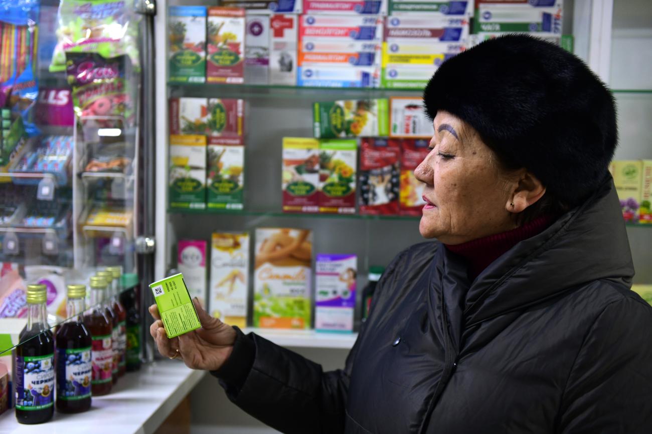 A woman is buying medicines
