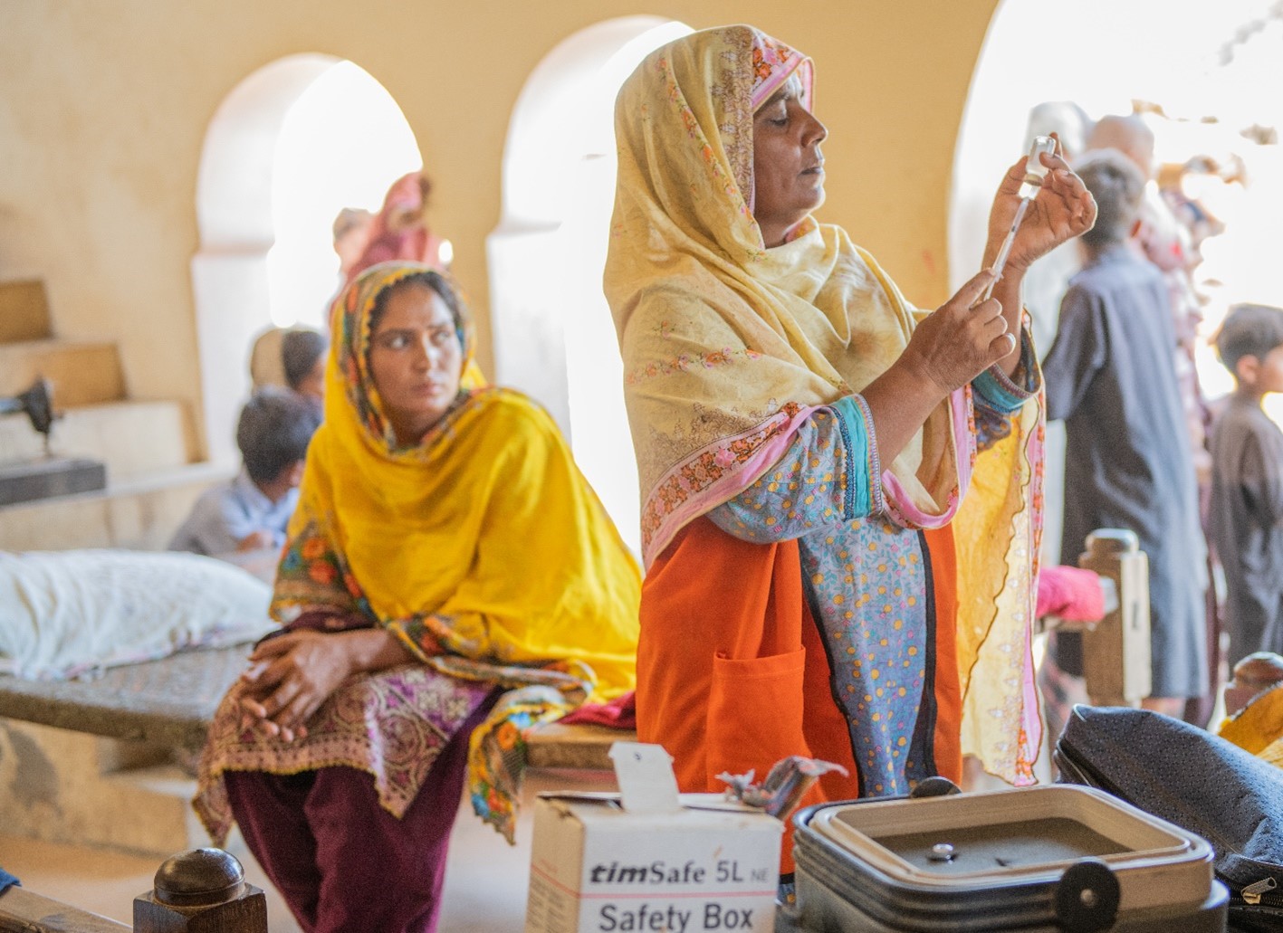 Close-up of a health worker preparing a vaccine