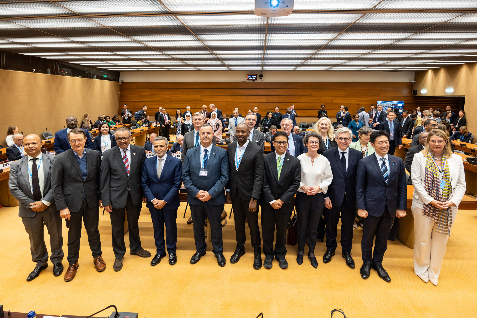 Members of the WHO Academy Group of Friends stand together in a conference room