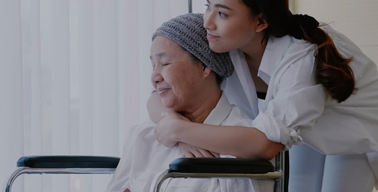 A health worker hugging a patient