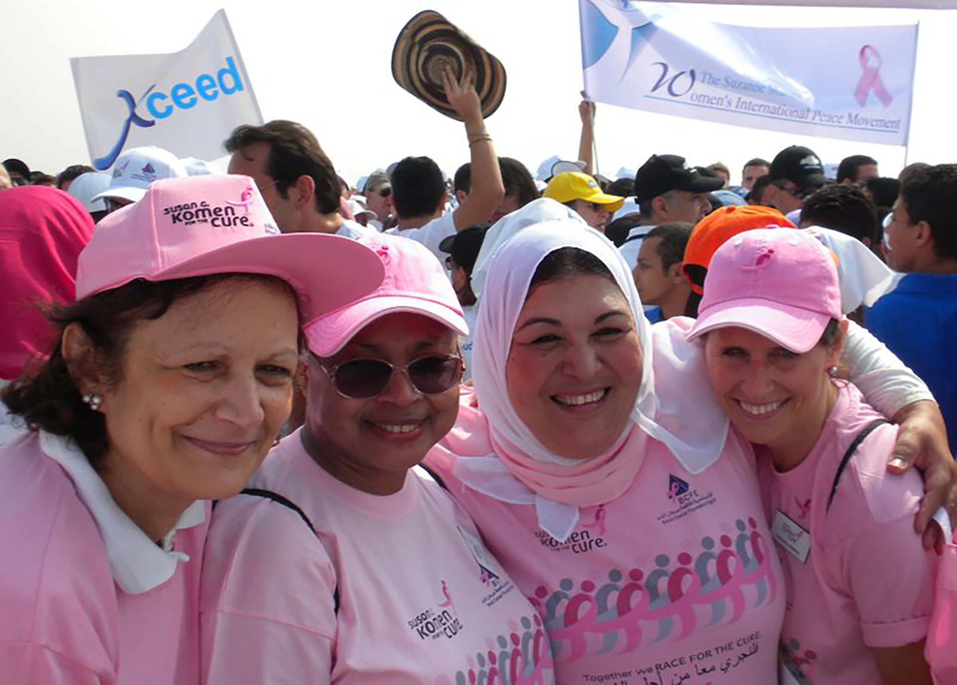 a group of women wearing pink t-shirts