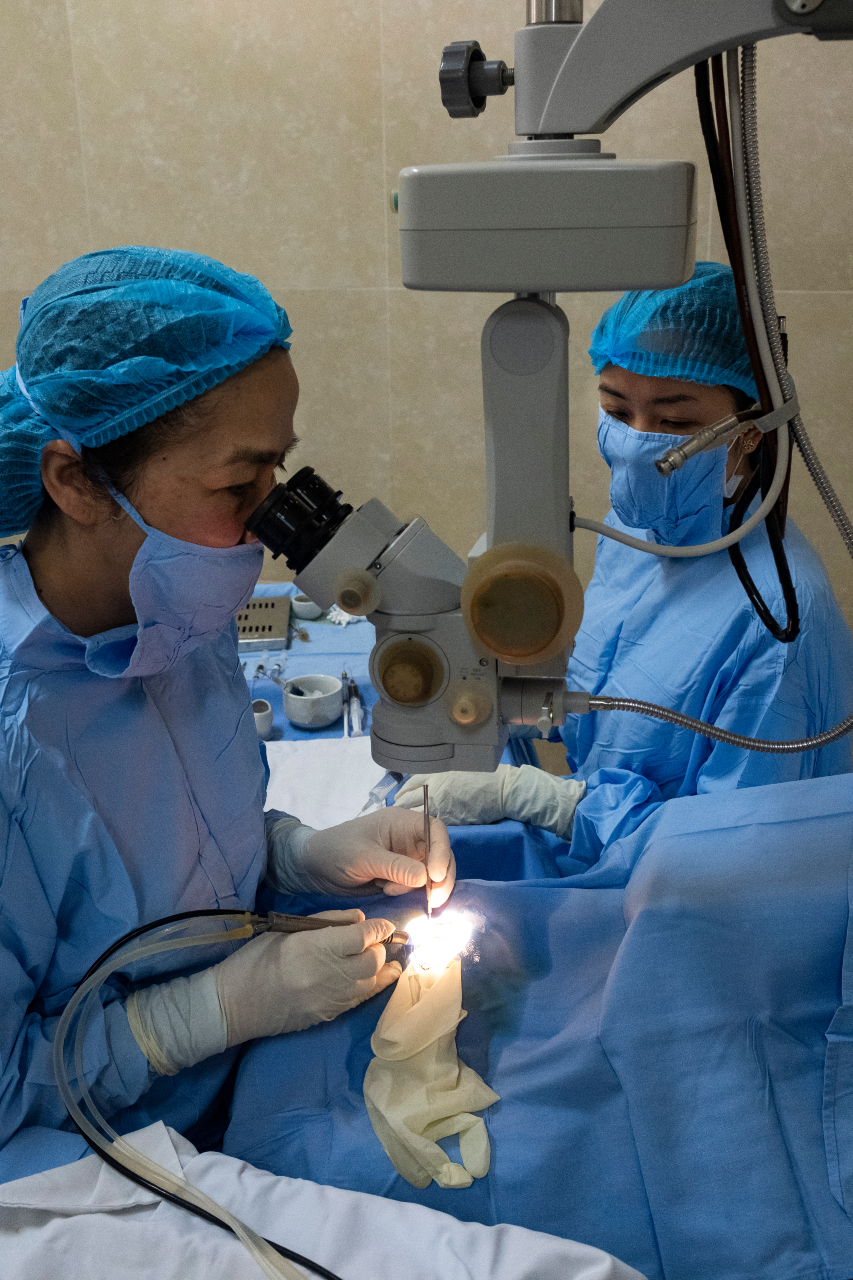 106_WHO Vietnam Medical staff performing eye surgery using medical devices