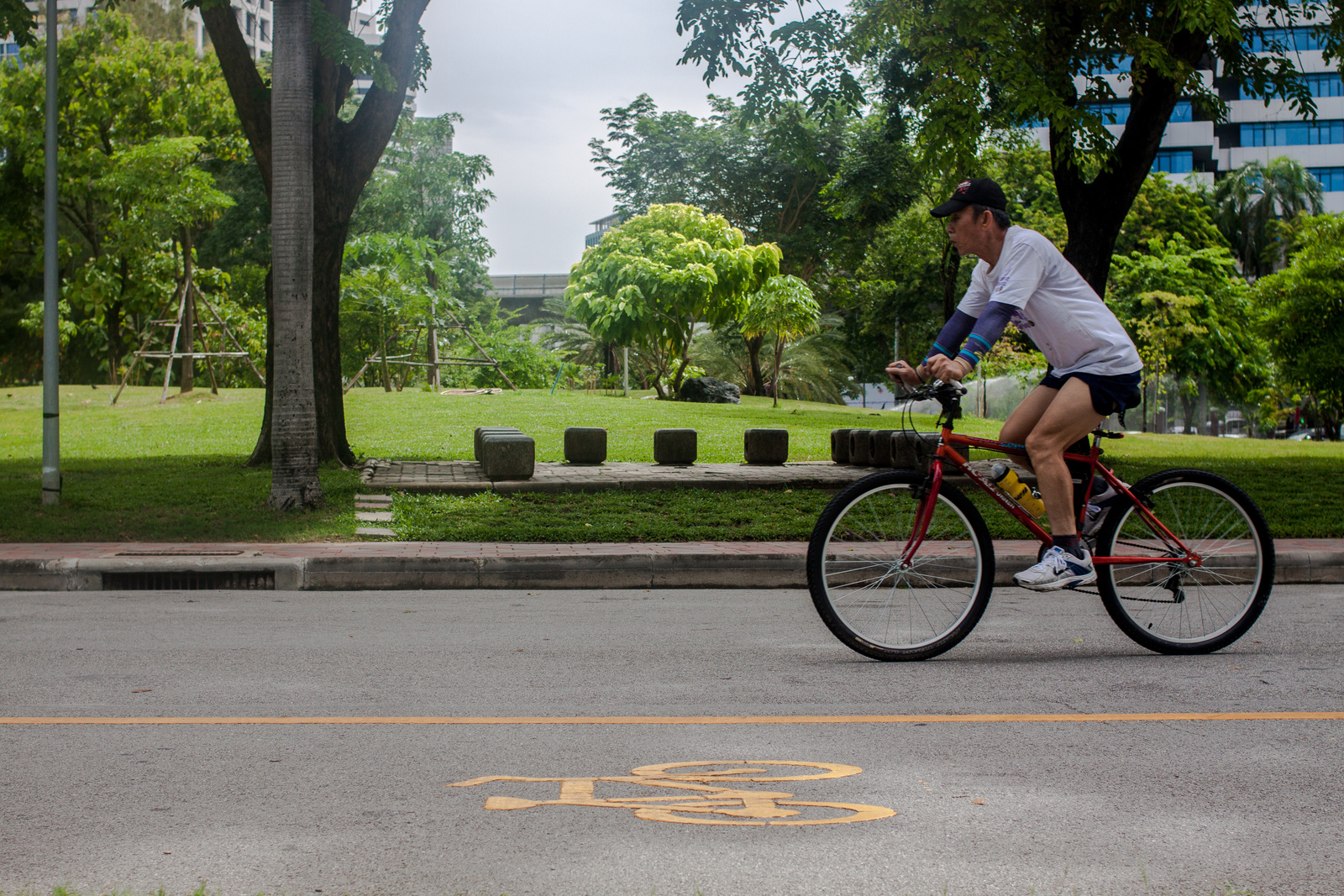 Man cycling on bicycle lane