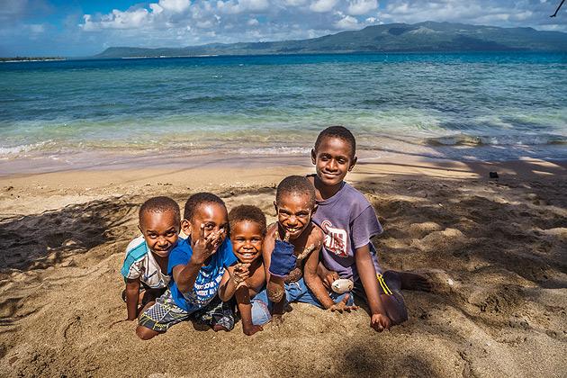 Five young boys on the beach, in Port Vila, Vanuatu