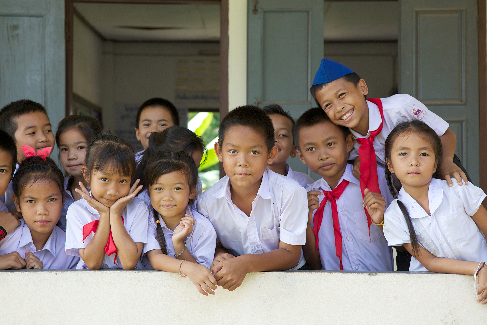 School children in Lao looking into the camera smiling