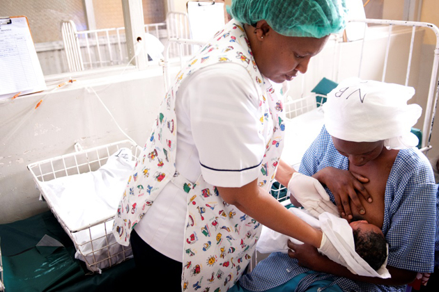 A midwife helps a mother with breastfeeding at a hospital