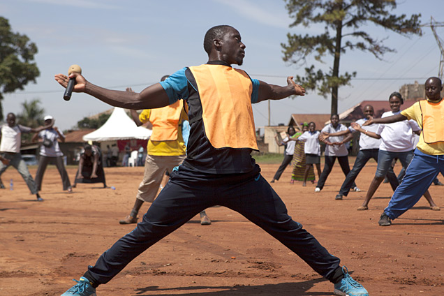 A man stretches during a group aerobics session to kick-start a NCDs awareness and screening campaign in Kampala, Uganda