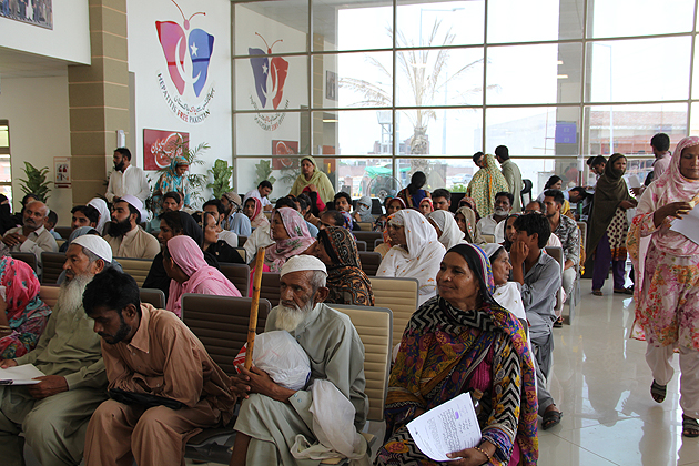 Patients waiting in lounge of hepatitis centre in Lahore, Pakistan