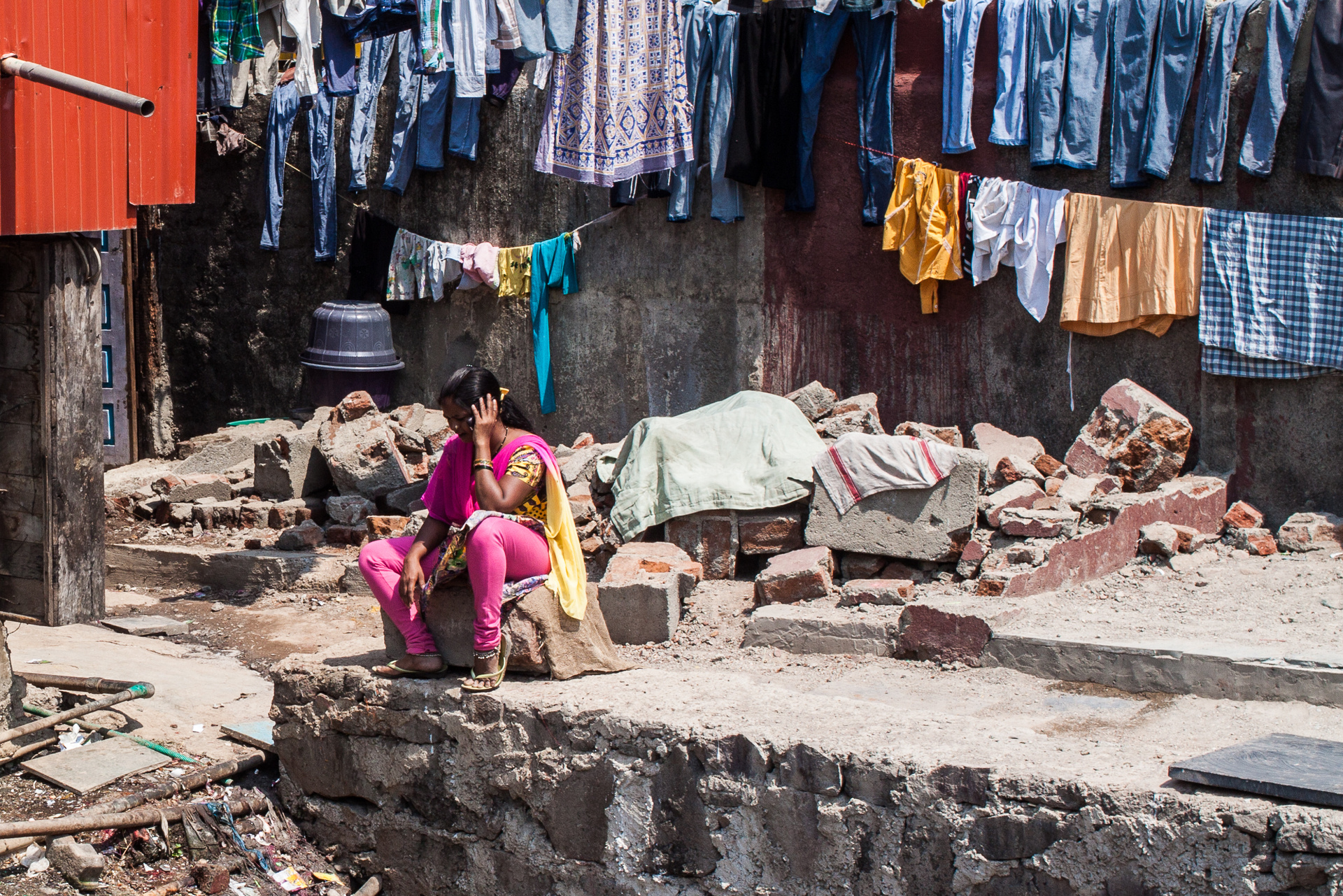 Mobile phone use in India. Woman talking on her mobile phone. Dharavi slum, Mumbai, May 2015