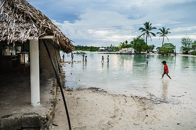 A child walking through sea in South, Tarawa, Kiribati