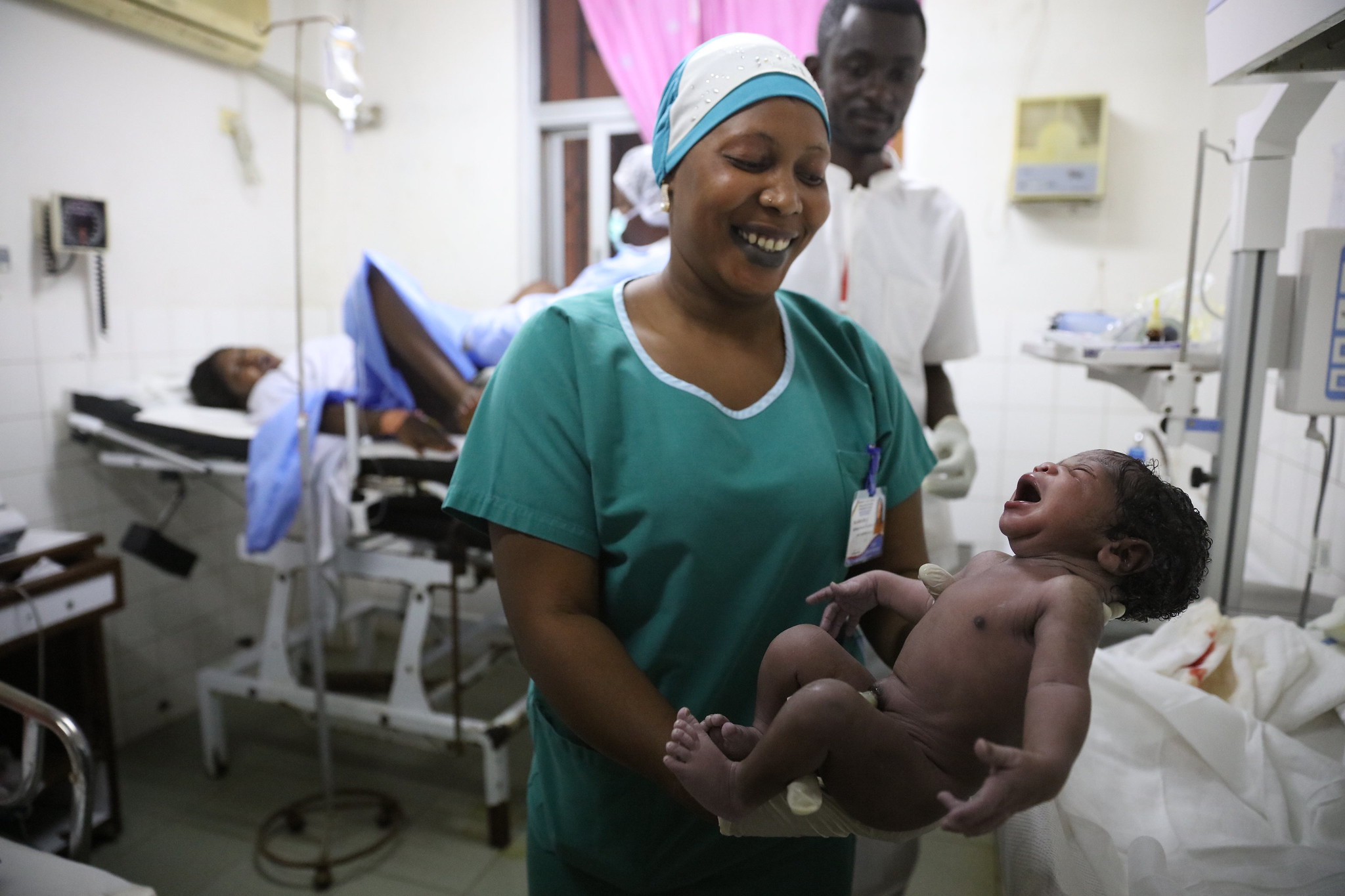 Midwife holding a newborn
