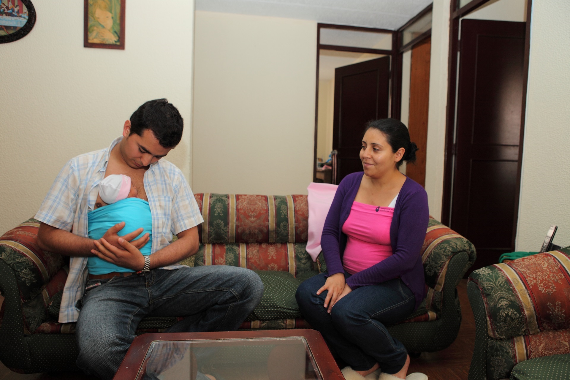 A father and his newborn in skin-to-skin contact A father provides skin-to-skin contact to his newborn at home.