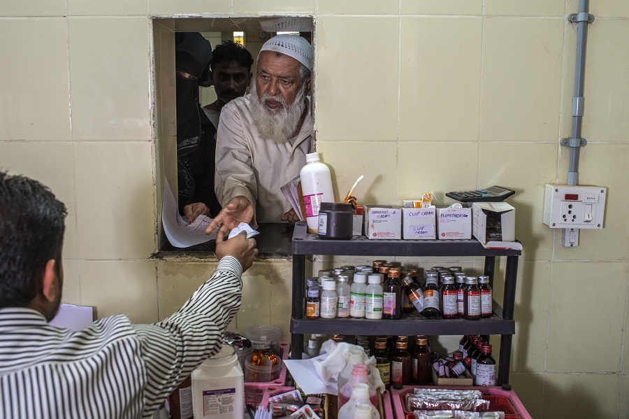 WHO_061390_Credit_Atul_LOKE_An elderly person collects medication__