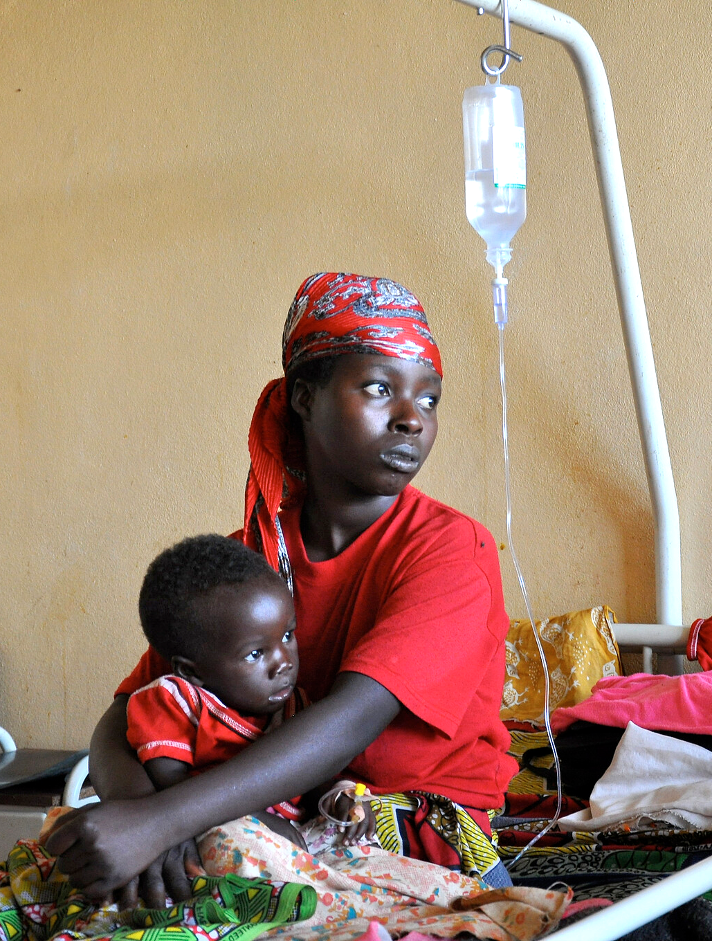 Mother and child getting treatment for malaria Mother and child getting treatment for malaria in a health care facility in Kisumu, Kenya