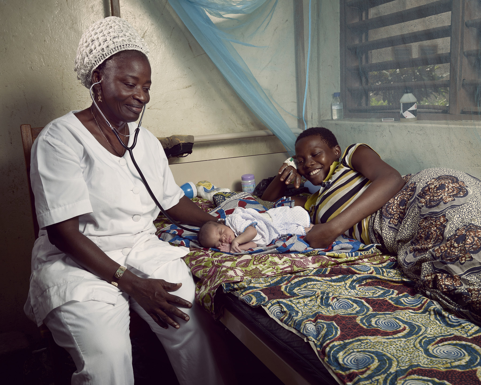 nurse taking care of newborn Benin