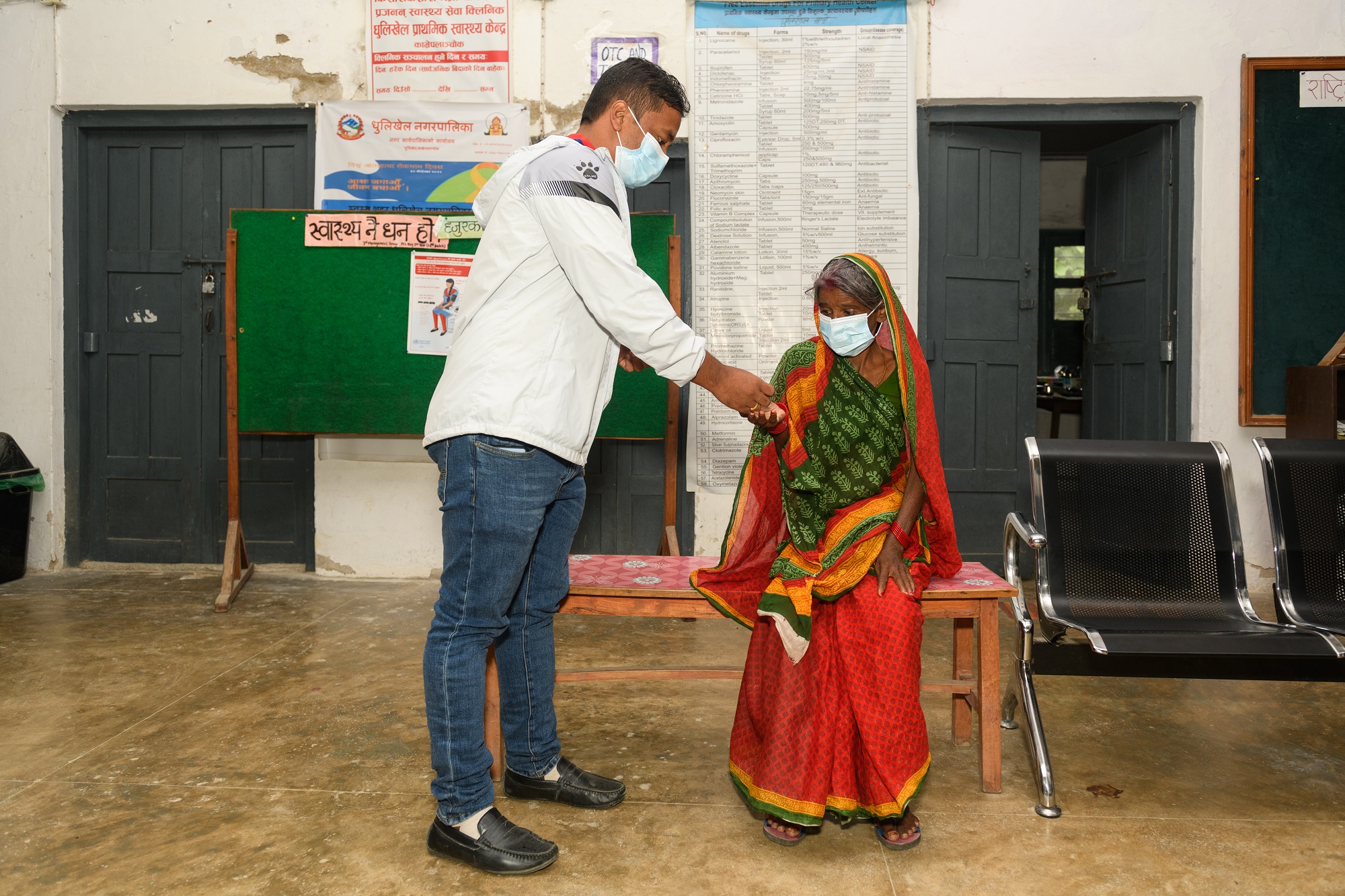 A healthcare worker providing medicines to a tuberculosis patient in Bagmati Province, Nepal