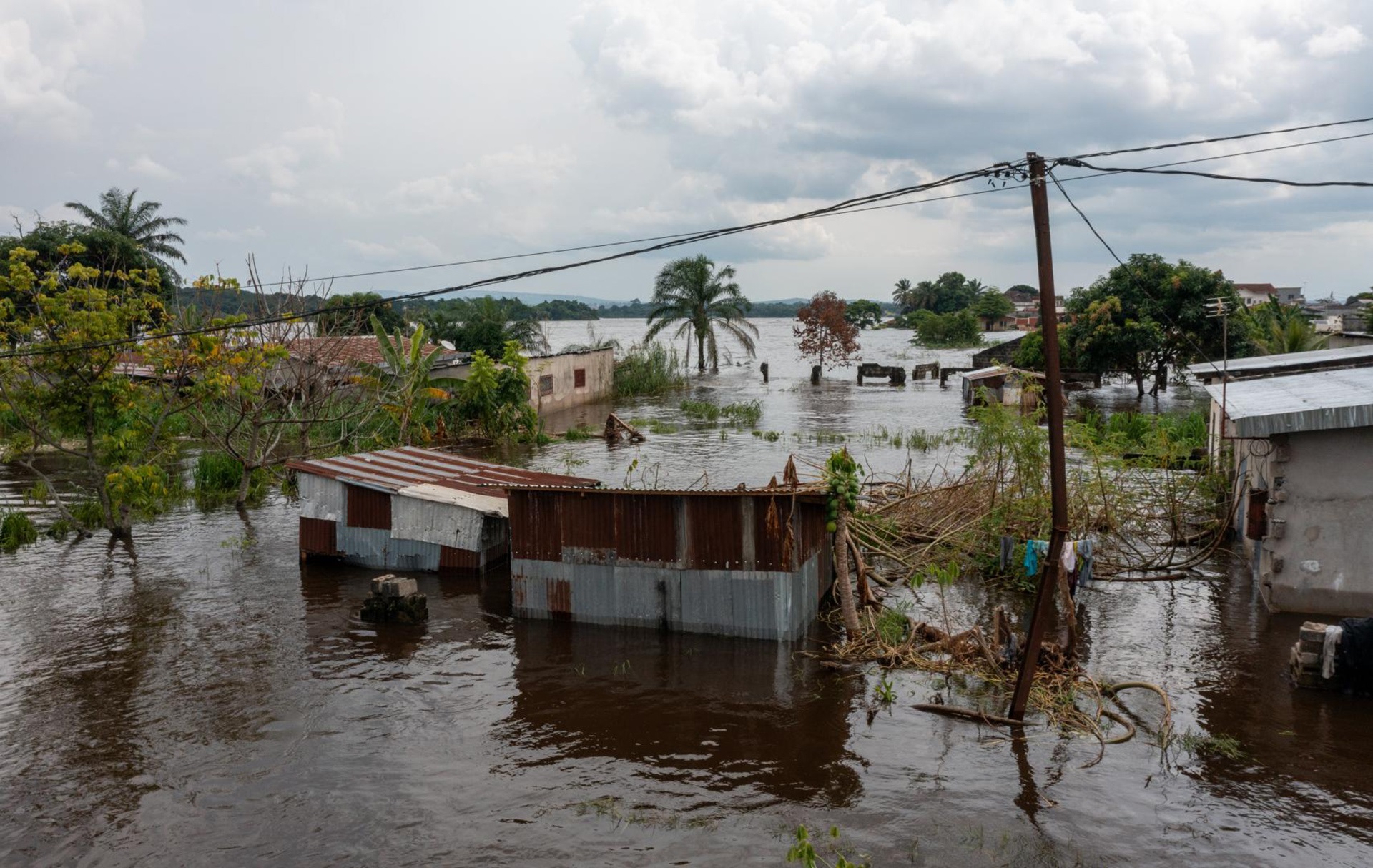 WHE 2025 Appeal Impact in 2024 Congo View over a flooded residential area near a river.
