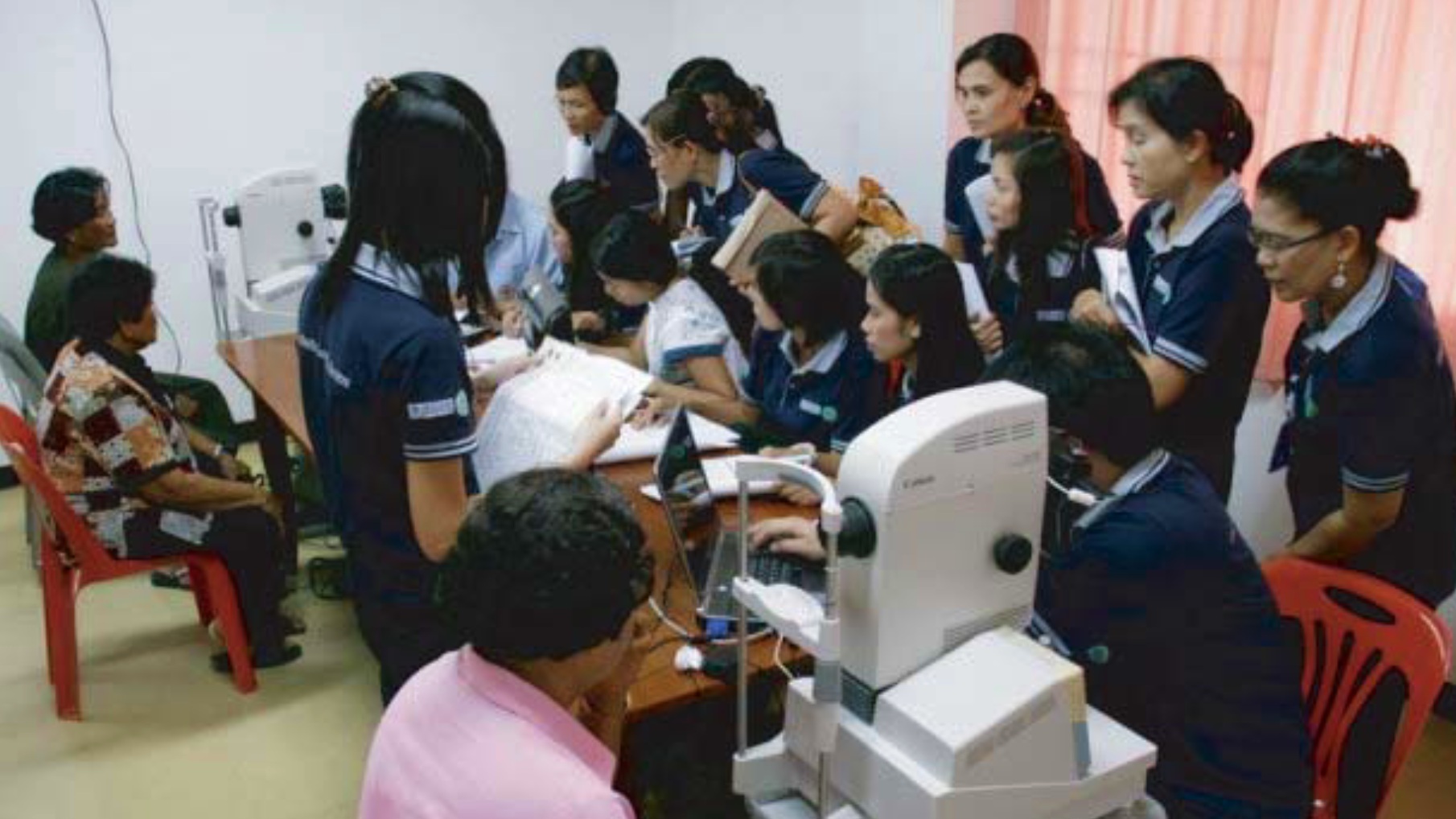 Health personnel in a room during a training session in diabetic retinopathy.