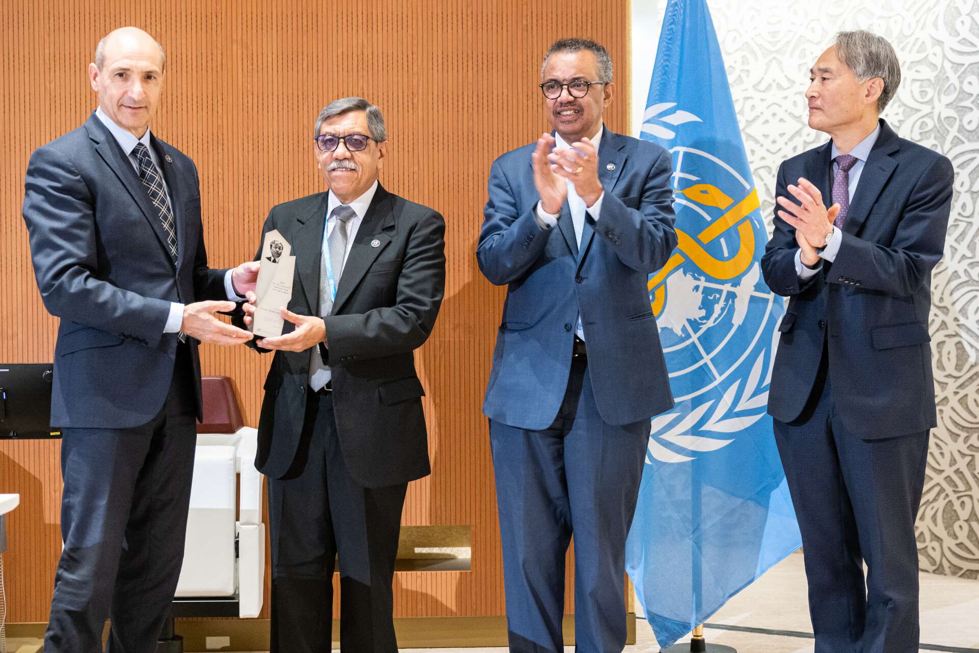 Dr Jorge Francisco Meneses receives a health prize at an award ceremony