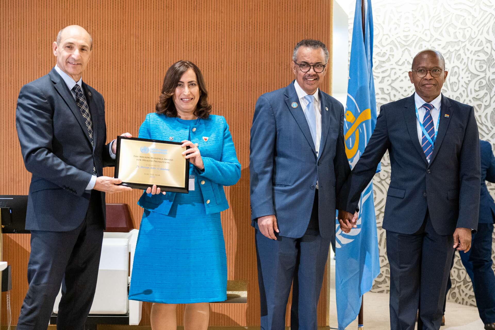 Dr Mariam Athbi Al Jalahma receives an award at a ceremony