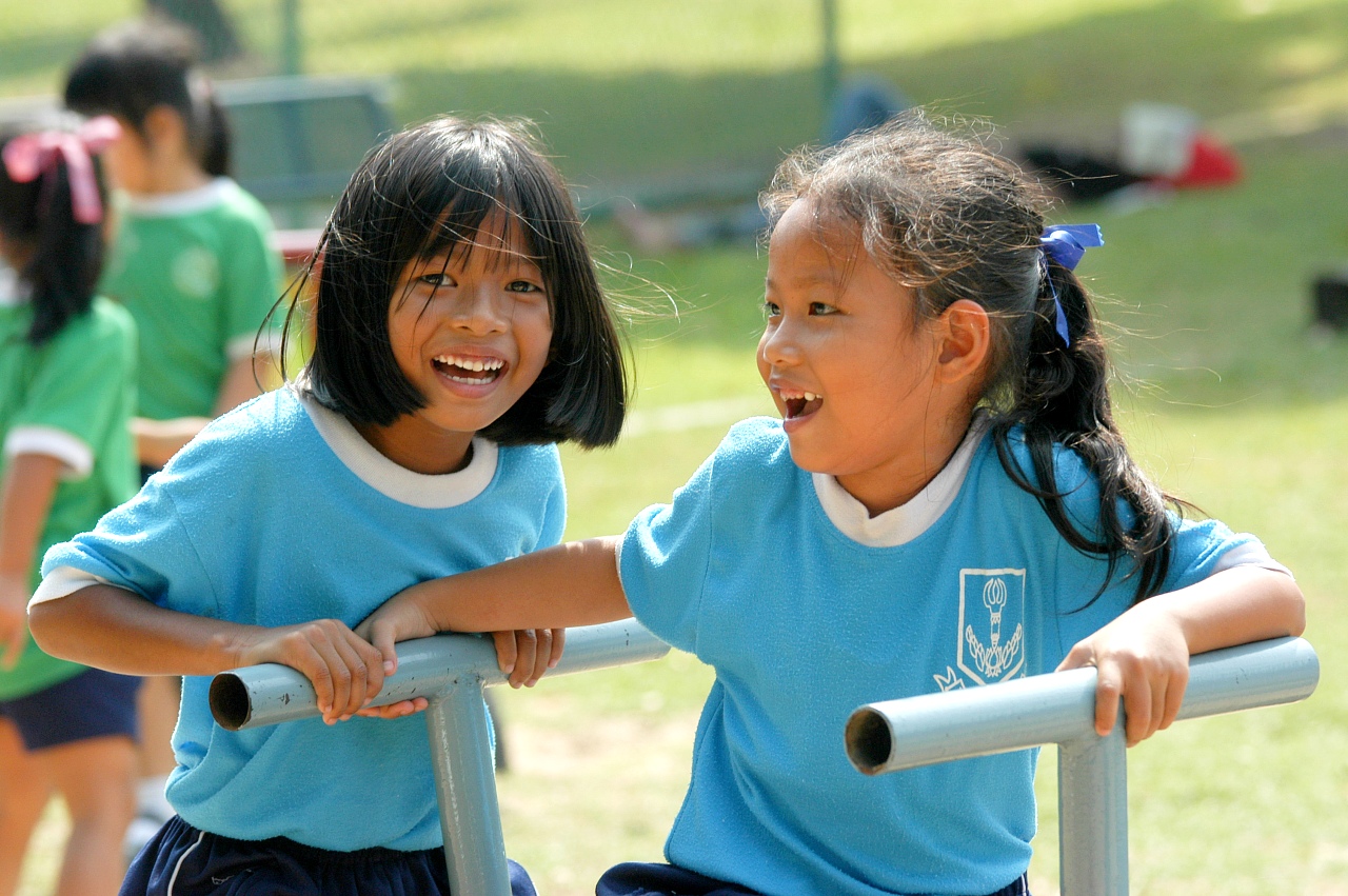 School kids are enjoying active play time, Thailand.