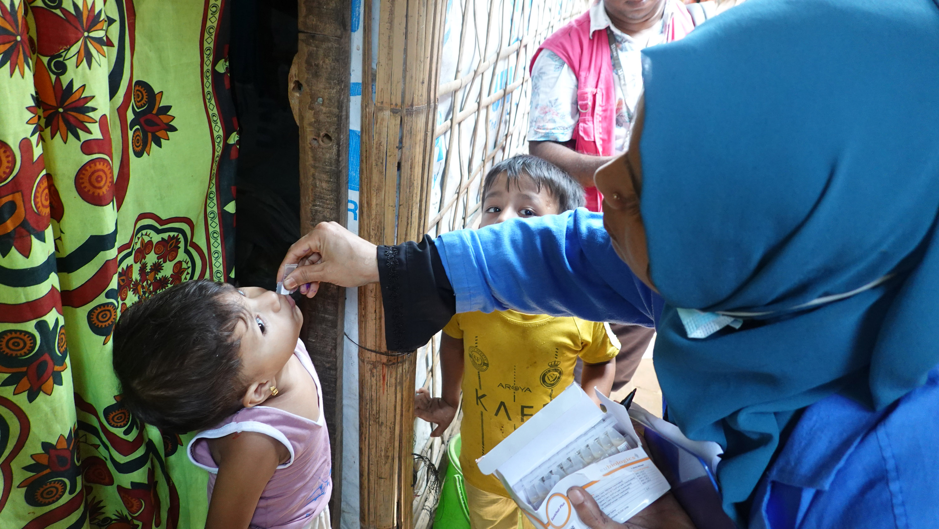 A young Rohingya girl receiving her second oral cholera vaccine dose at a refugee camp in Cox’s Bazar.