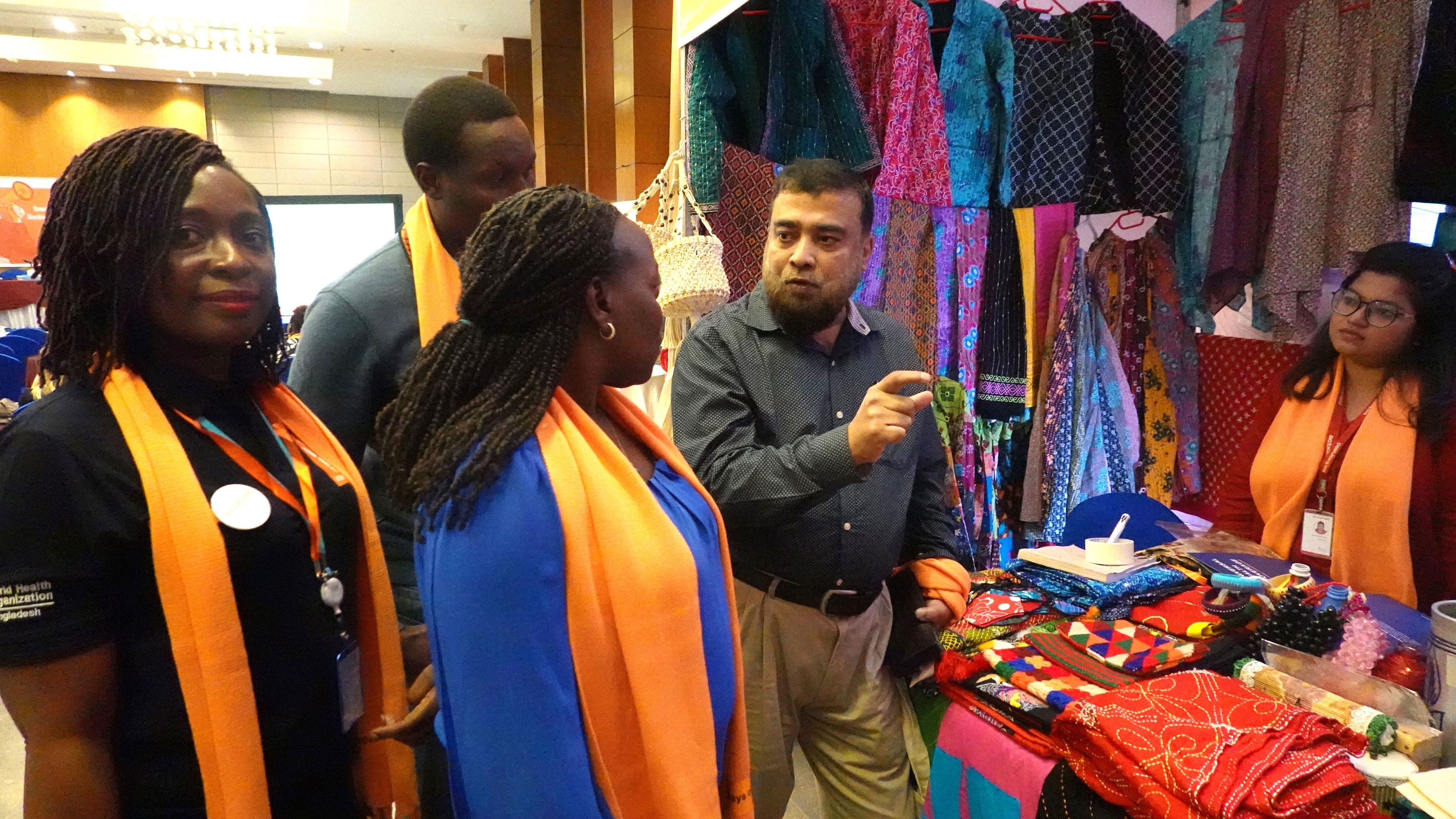 Dias members discussing the display of handcrafted items made by women in Rohingya camps,