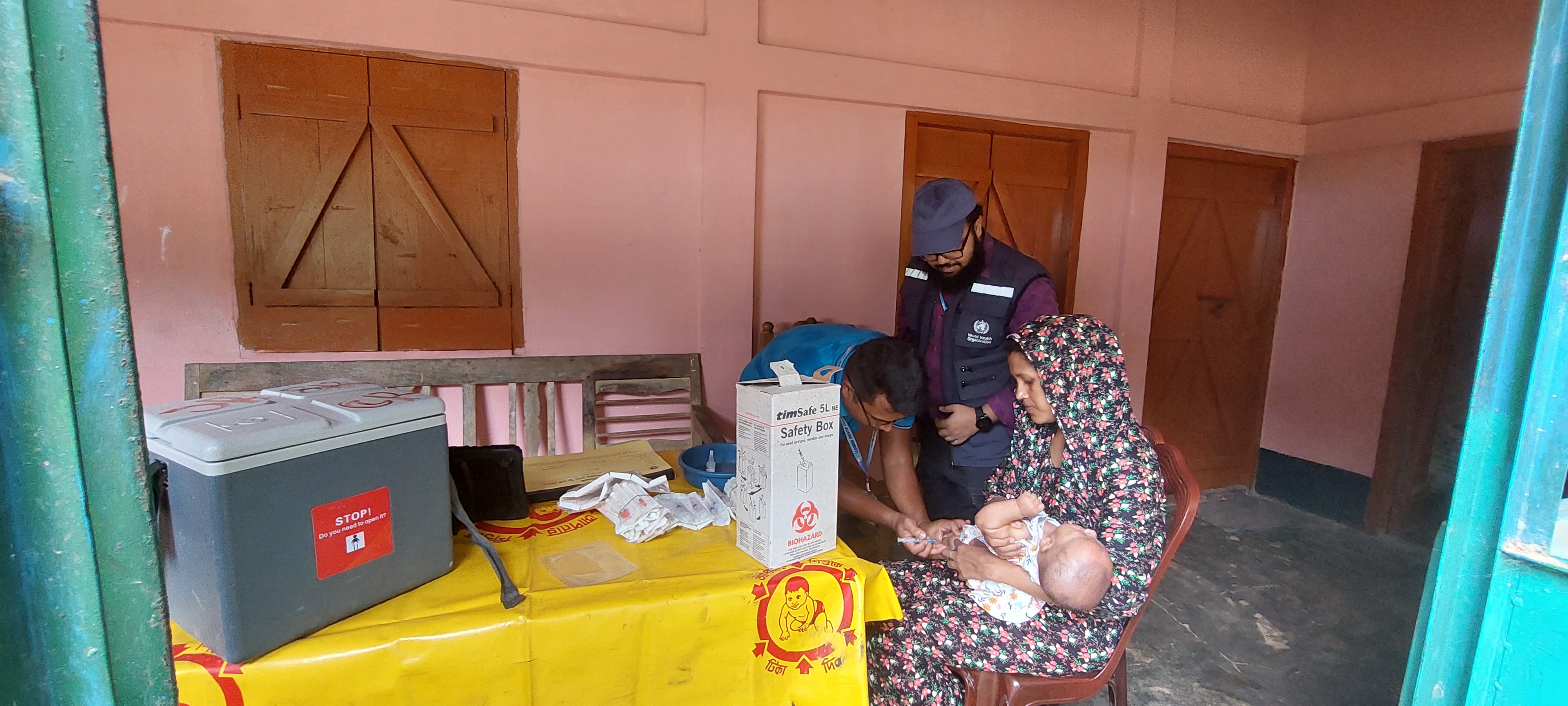 Faliha bravely receives her vaccine, a crucial step in safeguarding her future health