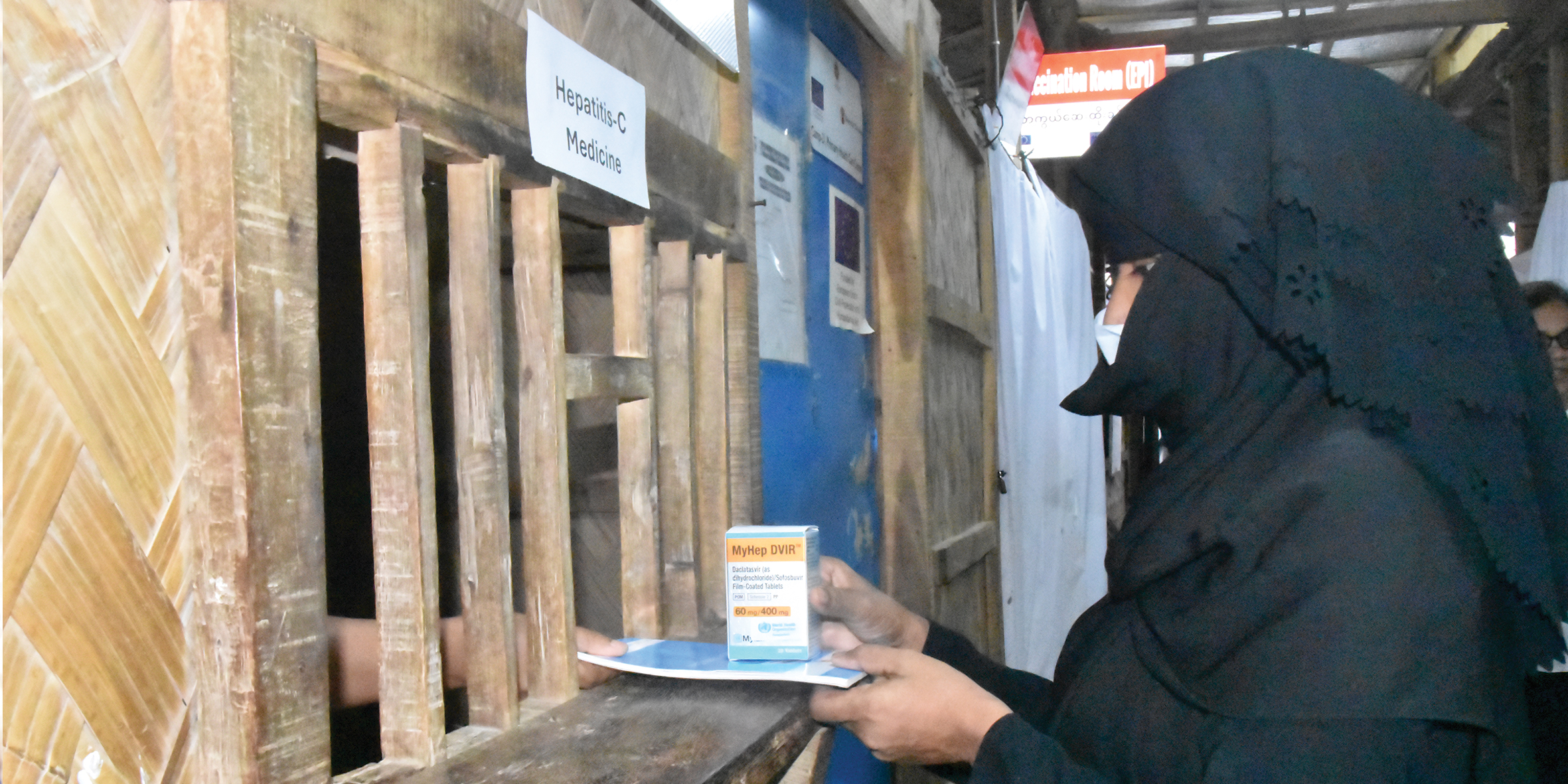 A Lady in black dress receiving Hepatitis C Medicine