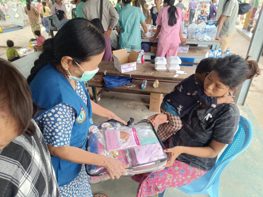 WHO health partner distributing Mother and Baby Packs to earthquake affected communities