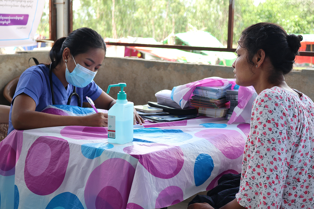 WHO health partner giving essential health care services at one of the earthquake relief camps in Mandalay