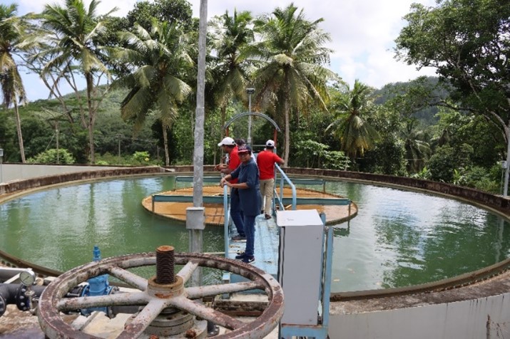 Participants engaged in practical field training, auditing water supply schemes, water treatment plants, distribution centers, and interacting with consumers.