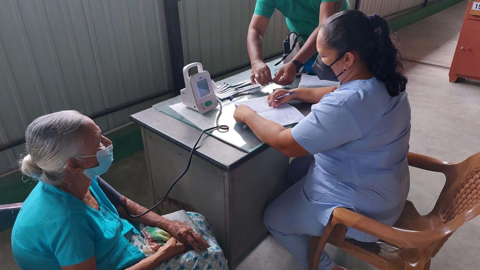 Hypertension screening being performed
